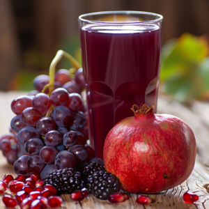 Immerse yourself in the vibrant zest of Zestful Blends with our Citrus Sunrise! This refreshing glass is bursting with goodness, surrounded by lush purple grapes, a whole pomegranate with scattered ruby seeds, and a cluster of juicy blackberries. The blurred greenery in the background hints at the unparalleled freshness of our ingredients—perfect for fruit salads, invigorating juices, wholesome snacks, nutrient-packed smoothies, whole fruit packs, and even delectable desserts. Experience the health benefits and eco-friendly charm of Zestful Blends!