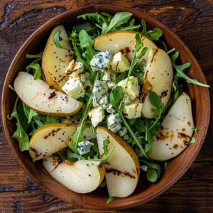 Indulge in the Pear & Blue Cheese Symphony, a harmonious blend bursting with goodness! Featuring crisp arugula, juicy pear slices, and rich blue cheese chunks, all perfectly balanced with a drizzle of balsamic vinegar. Experience vibrant flavors on an eco-friendly dark wooden surface. Freshness and health at their finest from Zestful Blends!