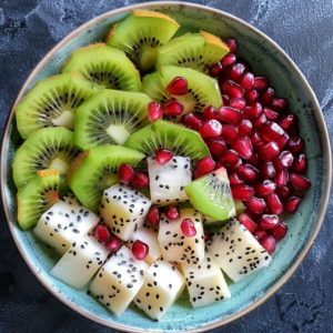 A stunning bowl bursting with goodness, featuring neatly arranged slices of green kiwi, exotic white Dragon Fruit Salad studded with black seeds, and ruby-red pomegranate jewels. The vivid colors of this delectable blend showcase the unparalleled freshness and health benefits Zestful Blends is known for. Enjoy a taste sensation that's as nutritious as it is visually captivating. Our eco-friendly practices ensure you savor nature’s best while caring for the planet!