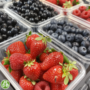 A close-up image showcases an array of our vibrant and tantalizing fresh berries, bursting with goodness in eco-friendly clear containers. Featuring juicy strawberries, antioxidant-rich blueberries, flavorful blackberries, and tangy raspberries alongside a shiny, perfectly ripe apple. The neatly arranged Apple Package radiates freshness and vitality, evoking the zestful spirit of our health-boosting fruit salads, revitalizing juices, wholesome snacks, invigorating smoothies, whole fruit packs brimming with nutrients, and delightful desserts. Enjoy nature's finest flavors delivered with Zestful Blends' commitment to sustainability and wellness.