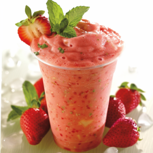 Behold the Strawberry Guava Groove Smoothie from Zestful Blends, bursting with goodness in every sip! This vibrant pink delight is topped with a fresh strawberry slice and fragrant mint leaves, all presented in an eco-friendly clear cup. Surrounding this refreshing treat are whole strawberries and glistening ice cubes, showcasing the unbeatable freshness and vitality of our products. Enjoy a wave of health benefits while indulging in this zestfully crafted smoothie experience!